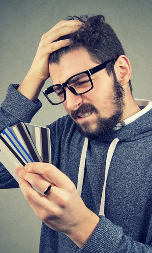 Man Looking At His Credit Cards - Business Consultant in Australia