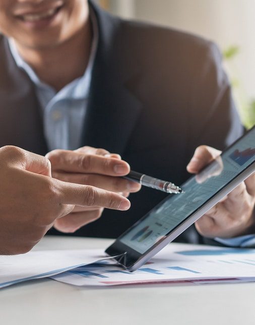 Man Pointing At Graphs - Business Consultant in Australia